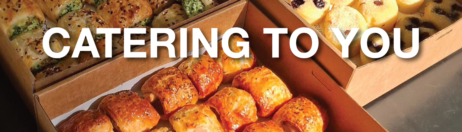 Boxes of fresh Joyride catering — sausage rolls, pastries and friands