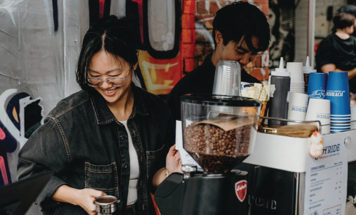 Joyride baristas serving coffee from the cart